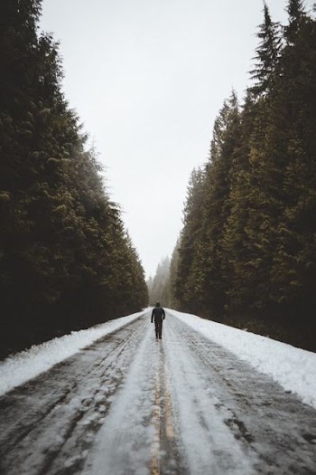 man in the middle of road