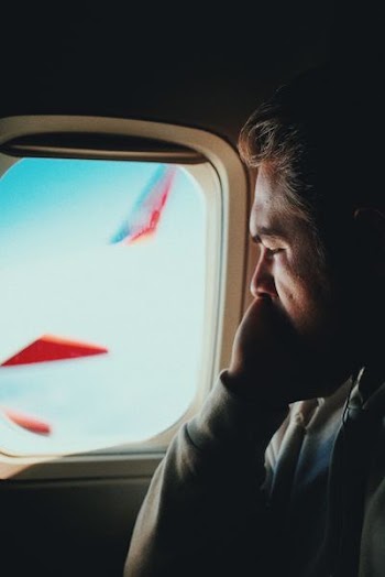 man in the vehicle watching window