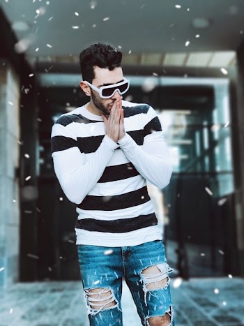 Man in White and Black Long-sleeved Shirt Posing