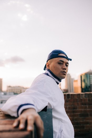 Man in White and Blue Windbreaker