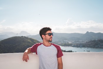 Man in White and Red Crew-neck T-shirt in Shallow Focus Photography