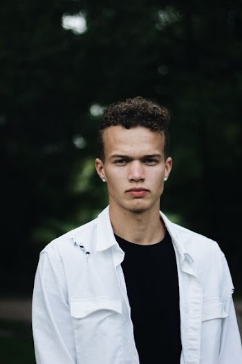 man in white collared top