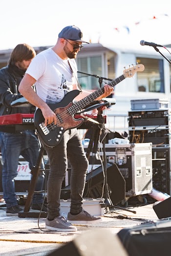 Man in White Crew-neck T-shirt Playing Black and Brown Electric Guitar