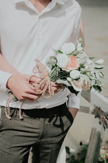 Man In White Dress Shirt Holding White And Pink Rose Bouquet