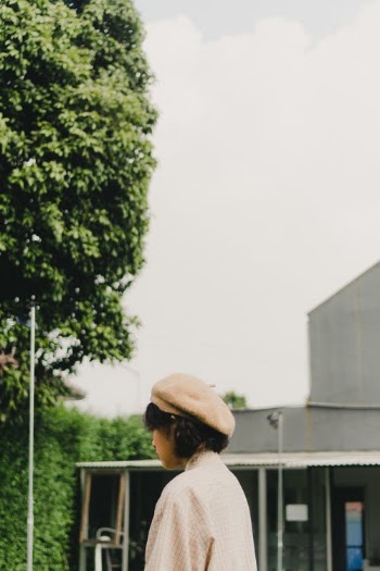 Man in White Hat Standing Near Green Tree · Free Stock Photo