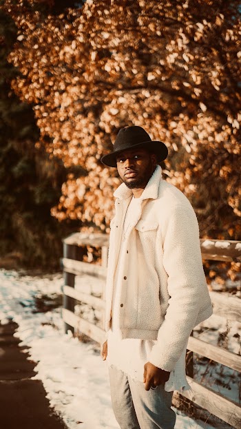 Man in White Jacket and Black Fedora Hat