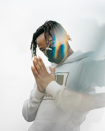 Man in White Jacket With Mask