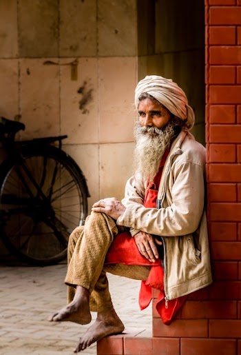 Man in White Kafiyeh Sitting