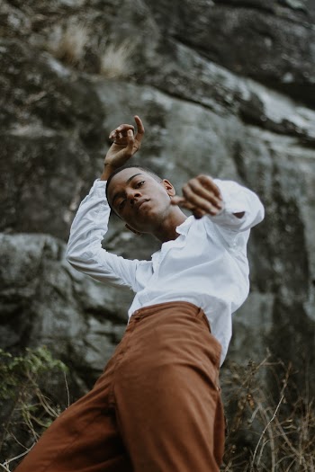 Man In White Long Sleeved Shirt and Brown Pants