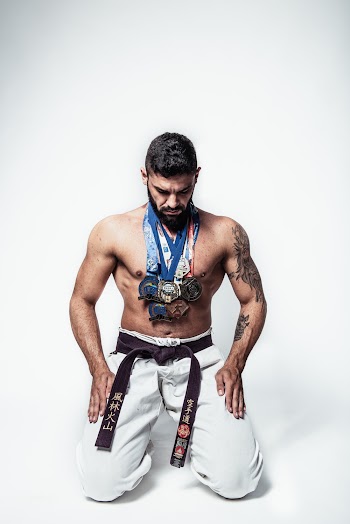 Man In White Pants Wearing Medals