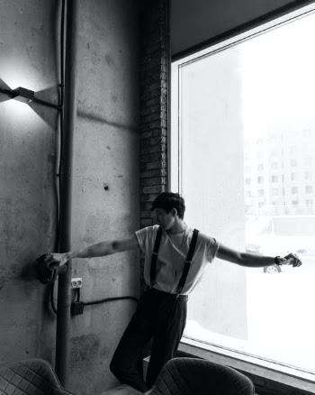 Man in White T-shirt and Black Pants Standing on Window · Free Stock Photo