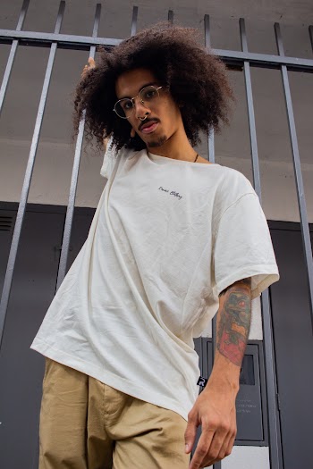 Man In White T-shirt Holding On The Rail