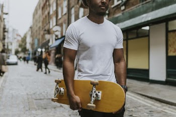 Man in white tee walking | Free Photo - rawpixel