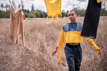 Man in Yellow and Blue Long-sleeved Top Walking Outdoors