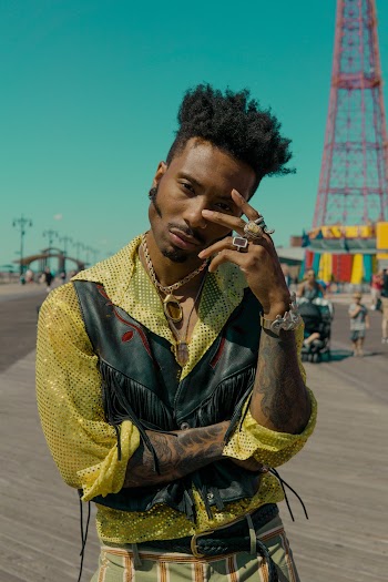 Man in Yellow Button-up Shirt and Black Leather Vest