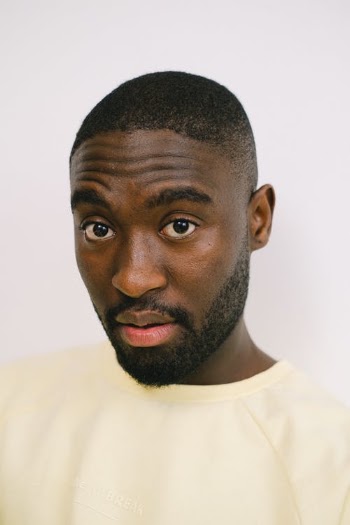 Man in Yellow Shirt Looking at Camera · Free Stock Photo