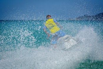 Man in Yellow Shirt Using Personal Watercraft