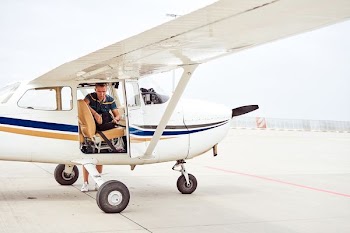 man inside of white airplane