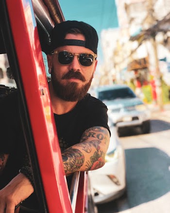 Man Inside Vehicle Waering Sunglasses