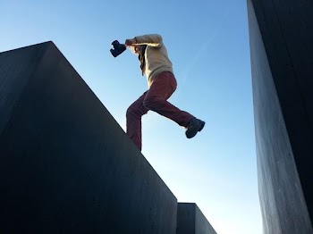man jump on gray surface
