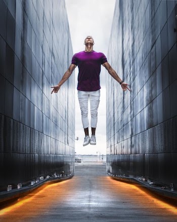 man jumping between buildings