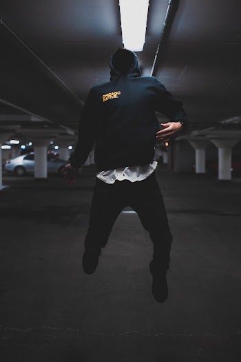 Man Jumping Inside Parking Area