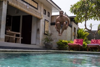 Man Jumping Into The Pool