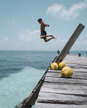 Man Jumping Into The Water