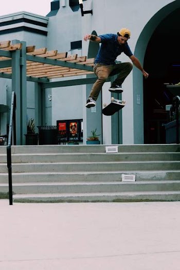 Man Jumping on Air over Flipped Skateboard