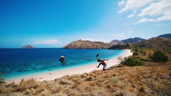 Man Jumping on Beach