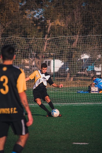Man Kicking Ball