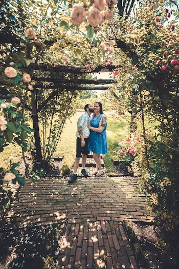 Man Kissing a Woman on Cheek at the Garden