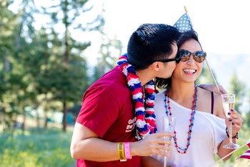 Man Kissing Smiling Woman On The Cheek 