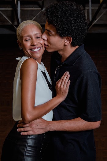Man Kissing the Woman Wearing White Dress
