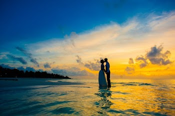 Man Kissing Woman