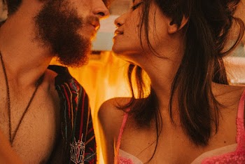 Man Kissing Woman