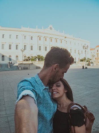 Man Kissing Woman's Forehead