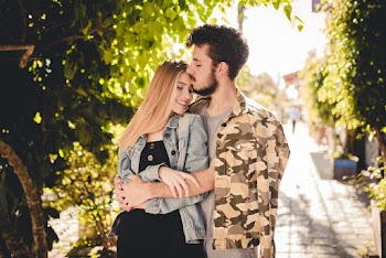 Man Kissing Woman's Forehead 
