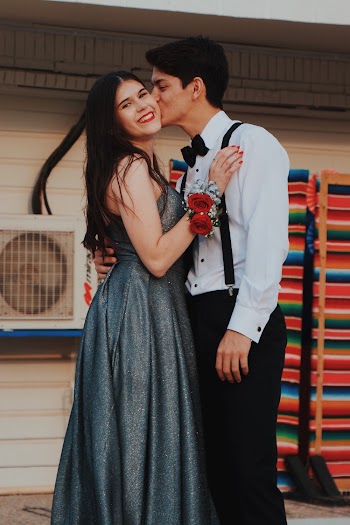 Man Kissing Woman on Her Cheeck