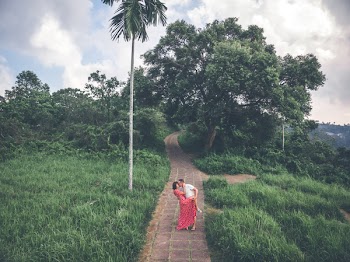 Man Kissing Woman Wearing Red Dress