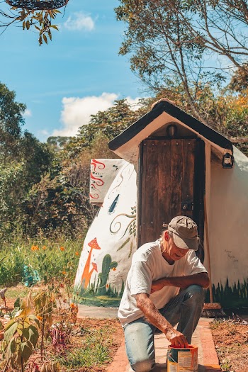 Man Kneeling on Ground