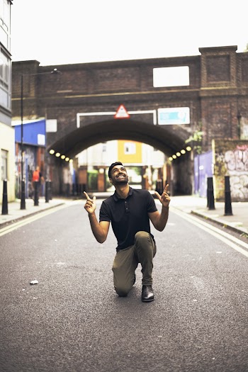 Man Kneeling on Road