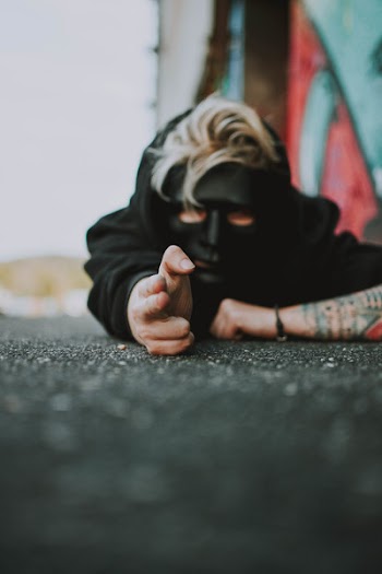 Man Laying On Ground