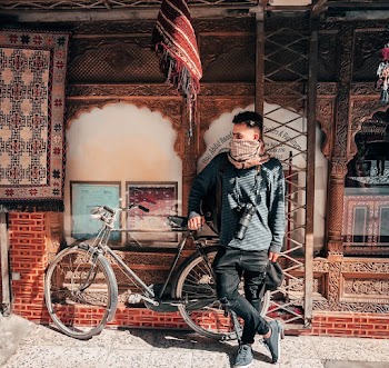 Man Leaning Against Bicycle