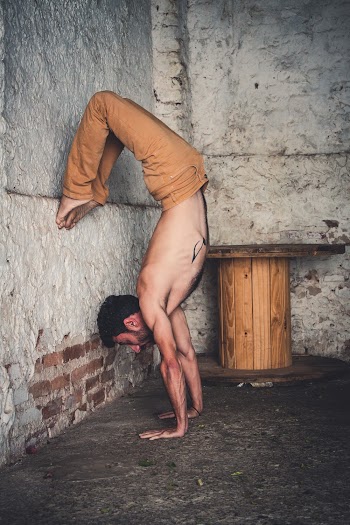Man Leaning His Feet on Wall