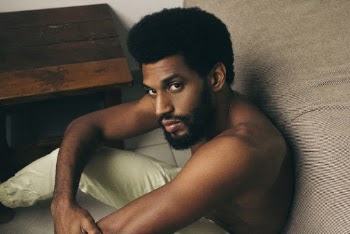 Man Leaning on Bed