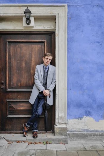 Man Leaning on Door
