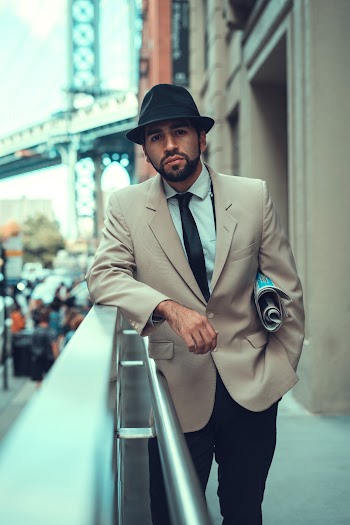 Man Leaning on Handrail