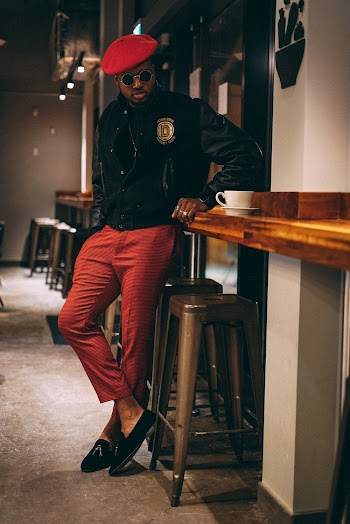 Man Leaning on Table