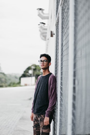 Man Leaning on Wall